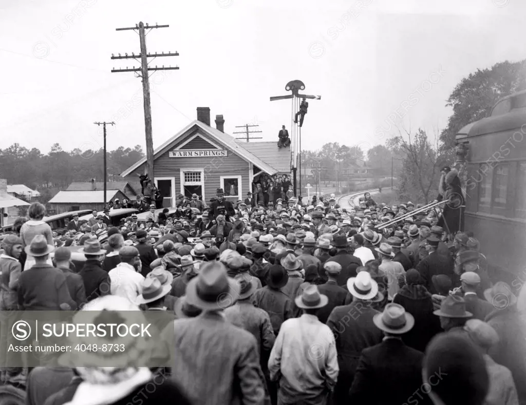 President-elect Franklin Roosevelt was greeted by a crowd at the Warm Springs railroad station. FDR arrived at his favorite vacation stop for the Thanksgiving holidays. Nov. 11, 1932.