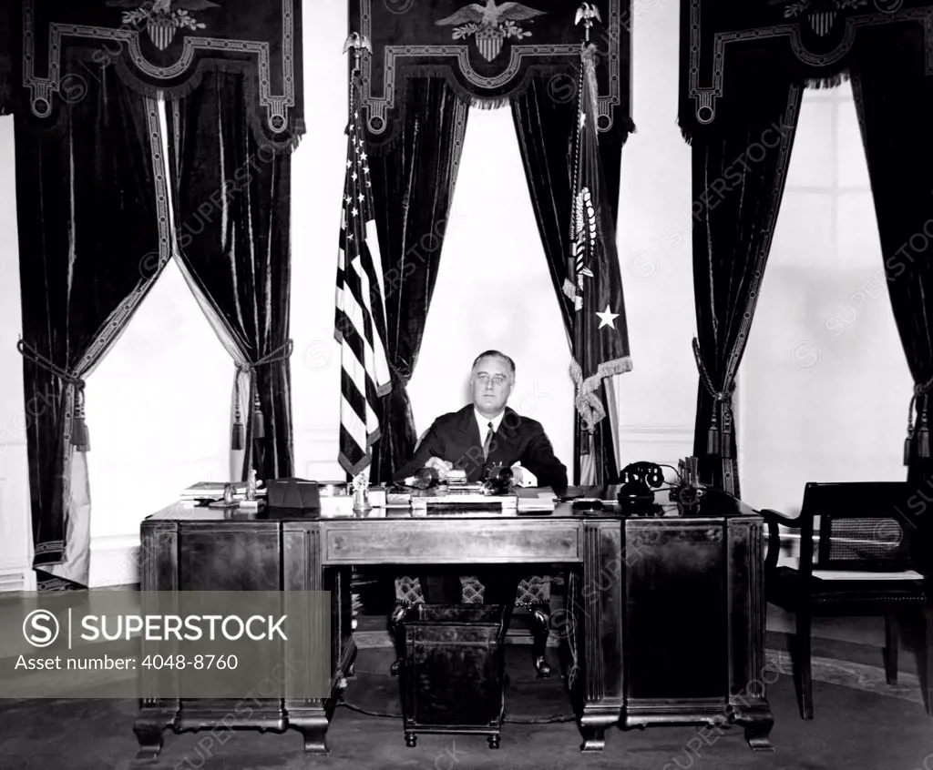 President Franklin Roosevelt at his desk in the Oval Office. Dec. 31, 1934.