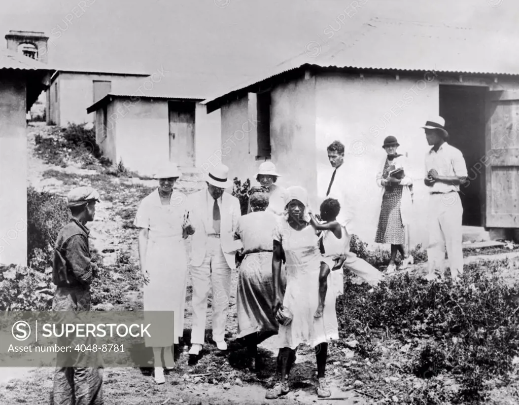 First Lady Eleanor Roosevelt tours the Virgin Islands. With Governor Paul Pearson, she visited residents of St. Croix living in new Pubic Works Administration (PWA) homes. March 12, 1934.
