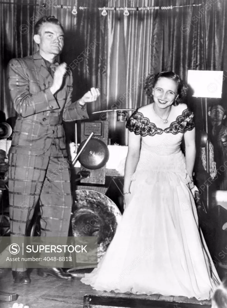 The President's daughter, Margaret Truman takes a bow. She sang with Spike Jones' orchestra at the 25th annual dinner of the White House Correspondents' Association. March 7, 1948.