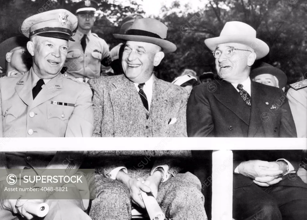 Harry Truman observing the first Armed Forces Day. Reviewing the parade in Washington, L-R: General Dwight Eisenhower, Secy of Defense, Louis Johnson, and President Truman. May 20, 1950.