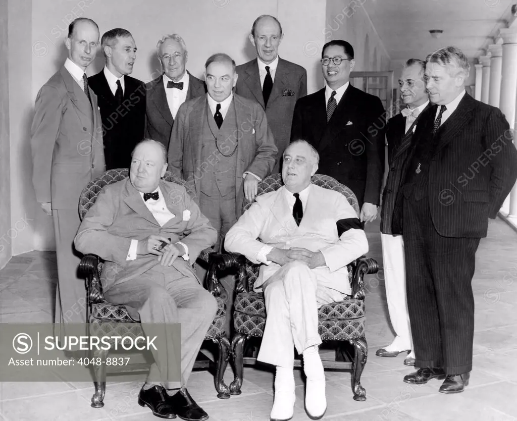 Allies of the Pacific War Council met at the White House on June 25, 1942. Seated: Winston Churchill and President Franklin Roosevelt. Standing, L-R: Eelco van Kleefens of Netherlands, Sir Owen Dixon of Australia, Leighton McCarthy of Canada, Canadian Premier MacKenzie King, Lord Halifax, Dr. T.V. Soong of China, Philippine President, Manuel Quezon, and Walter Nash of New Zealand.