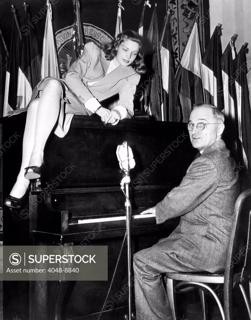 Actress Lauren Bacall sits atop the piano while Vice President Harry Truman plays. The iconic photo was taken at the National Press Club Canteen, where Bacall and the Vice President entertained American servicemen. Feb. 10, 1945.