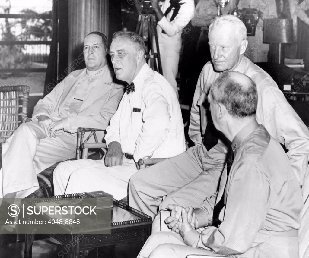President Franklin Roosevelt at Pearl Harbor on June 11, 1944. L-R: General Douglas Mac Arthur, President Roosevelt, Admiral Chester Nimitz, and Admiral William Taft Leahy.