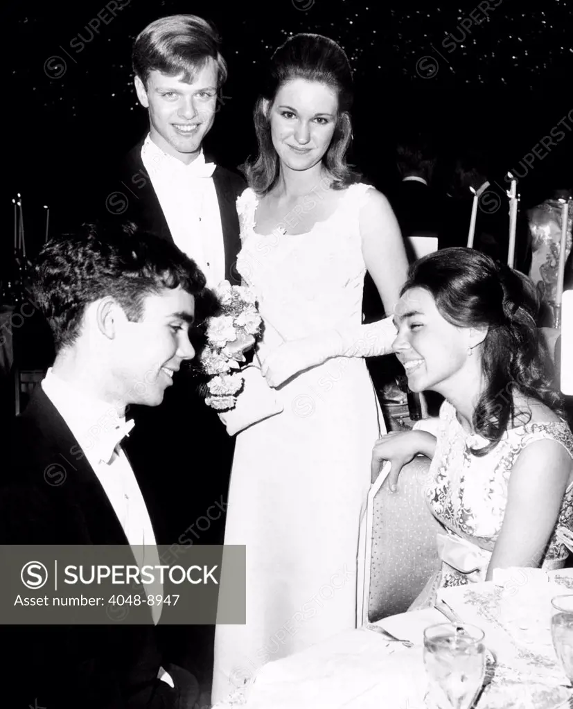 Eisenhowers attended the International Debutante Ball at the Waldorf Hotel. L-R: Dwight David Eisenhower II, Barbara Anne Eisenhower, Don Stolper, and Julie Nixon, Eisenhower's fiancée. Dec. 29, 1967.