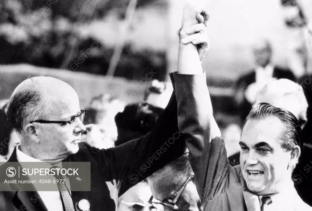 Segregationist solidarity. Georgia Gov. Lester Maddox leads cheers for Alabama Gov. and American Independent Party presidential candidate George Wallace. Wallace won Georgia's electoral votes. Nov. 4, 1968.