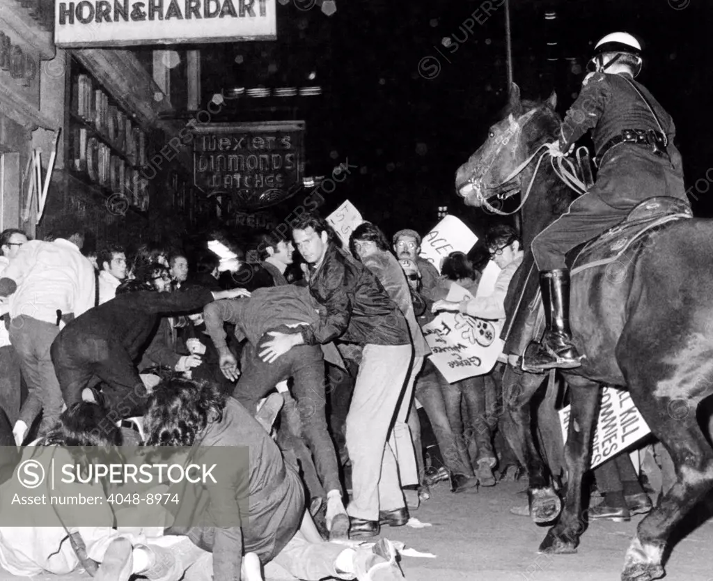 Demonstrators pushed by New York City police. Anti-Wallace demonstrators outside Madison Square Garden were on hand for segregationist George Wallace first NYC campaign appearance. Oct. 25, 1968.