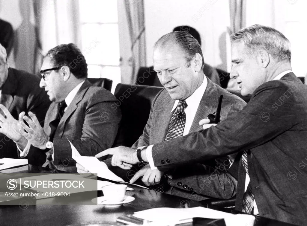 Gerald Ford at a Cabinet meeting during his first month as President. L-R: Henry Kissinger, Secy. of State, Pres. Ford, James Schlesinger, Defense Secy. Aug. 26, 1974.
