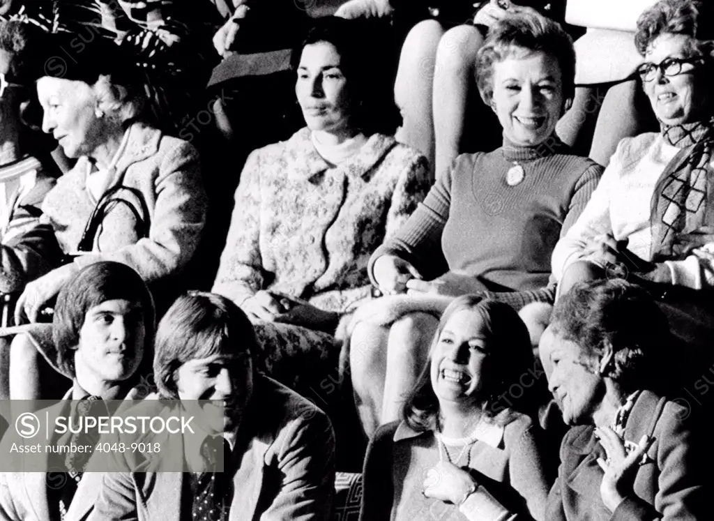Family and friends watch Gerald Ford sworn in as Vice President. In the gallery of the House of Representatives are, L-R: Ford's sons, Jack and Mike, daughter, Susan, First Lady Pat Nixon. Rose Mary Woods, President Nixon's personal secretary, is 2nd from right in second row. Dec. 6, 1973.