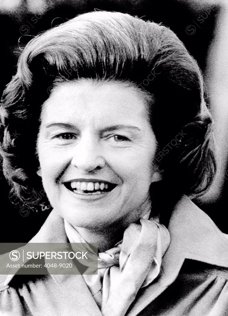 First lady Betty Ford talks to newsmen as she leaves nearby Bethesda Naval Hospital. She won praise for her candid discussion of her breast cancer surgery. Oct. 11, 1974.