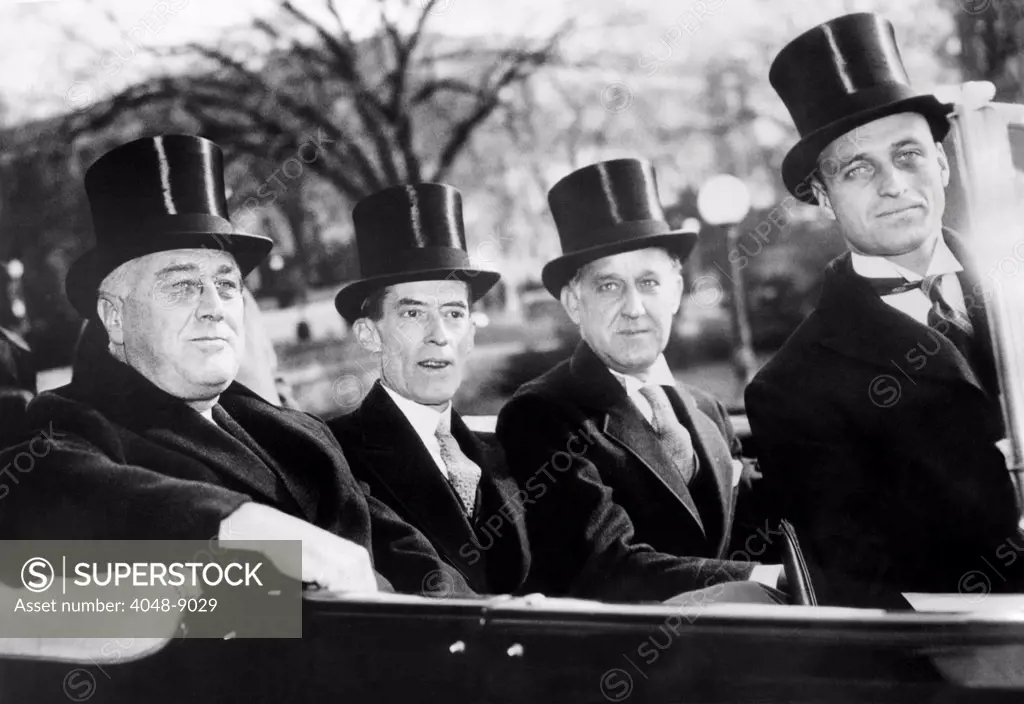 President Franklin Roosevelt with his secretarial staff in top hats when the President made his state of the Union speech to Congress. R-L: FDR, Marvin McIntyre, Stephen Early, and James Roosevelt. Jan 6, 1937.