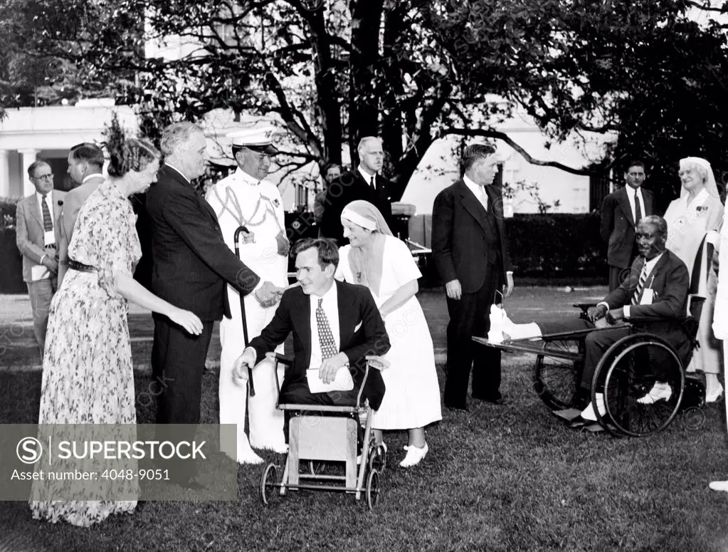 President Franklin Roosevelt and the First Lady received veterans from Walter Reed Hospital at a White House garden party. On Memorial Day weekend, they greeted legless World War I hero, Guy Pendleton and others. May 31, 1936