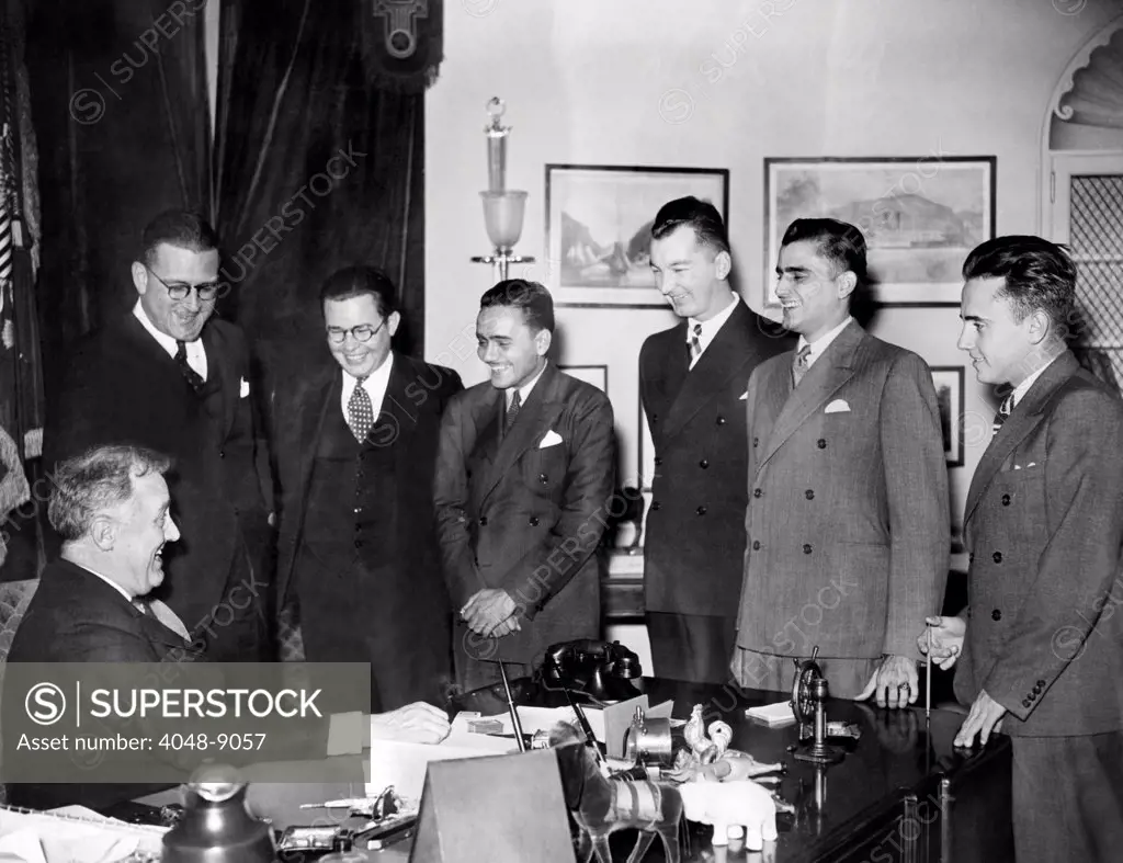 President Franklin Roosevelt met with the victorious University of Puerto Rico debating team. They scored a hundred percent in their victories with teams in leading cities of the US. L-R: Dr. Carlos Chardon, Richard Pattee, Caspar Rjvera-Cestero, Otto Riefkohl, Arturo Morales Carrion, and Francisco Ponsa Feliu. March 13, 1935.