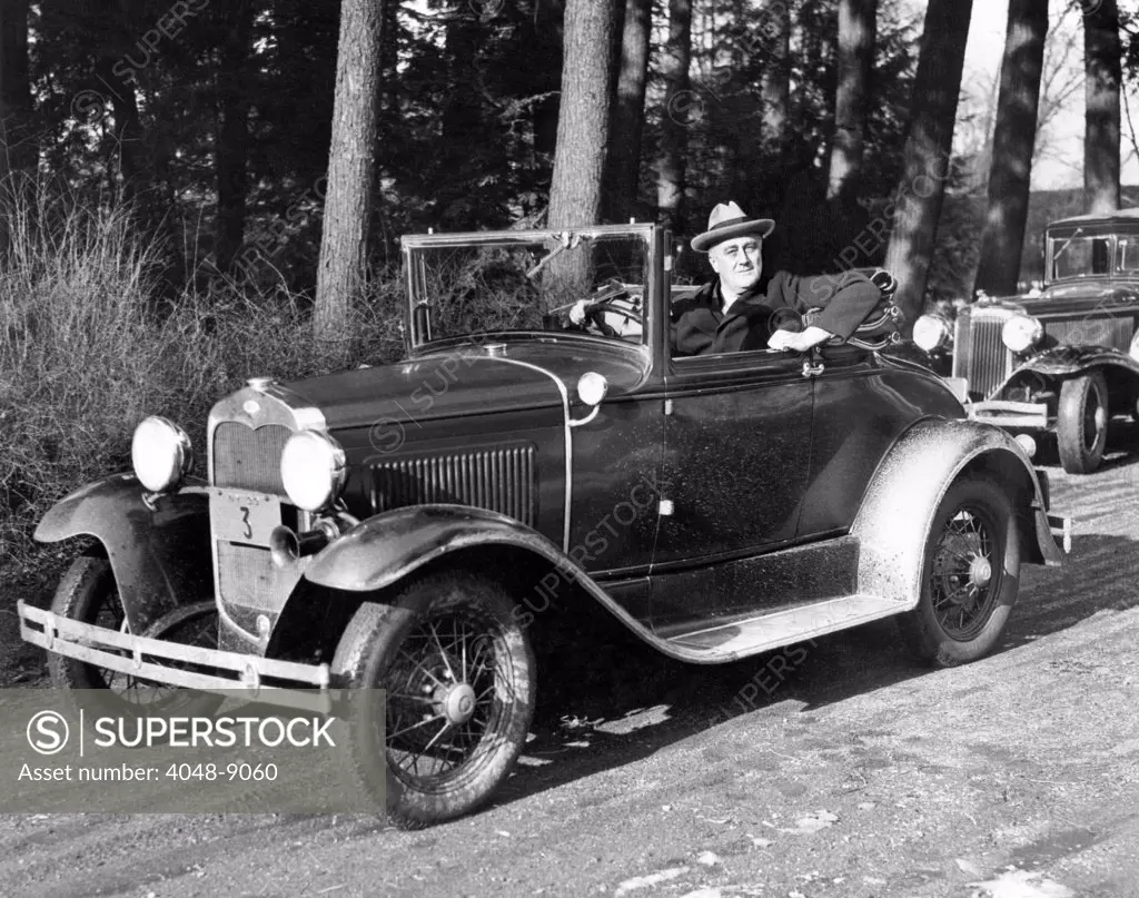 President-elect Franklin Roosevelt driving at Hyde Park, NY. His car was designed with hand controls replacing foot pedals, so he could drive in spite of his paralyzed legs. Jan. 15, 1933.