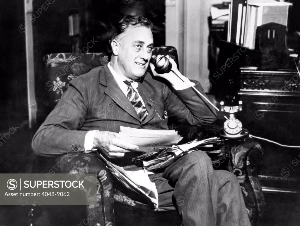 Governor Franklin Delano Roosevelt. He takes via long distance telephone to his representatives at the Chicago Democratic Convention following his nomination as the party's candidate for the Presidency. July 2, 1932.