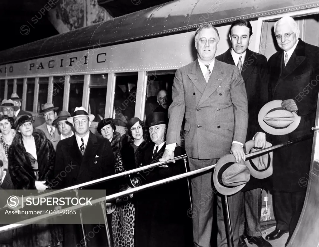 President Franklin Roosevelt inspects the new Union Pacific Streamliners. He is with Averill Harriman, Chairman of the Board of Union Pacific, and C.R. Gray, President of Union Pacific. It was called the M-10000 and was a prototype of the first streamlined internal-combustion passenger train. Feb. 19, 1934.