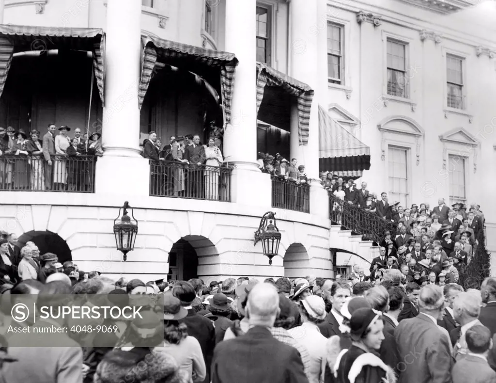 Harvard Class of 1904 reunion at the White House. President Franklin and Eleanor Roosevelt are on the South Portico of the White House as President's Harvard University classmates gather for a 30 year reunion. April 21, 1934.
