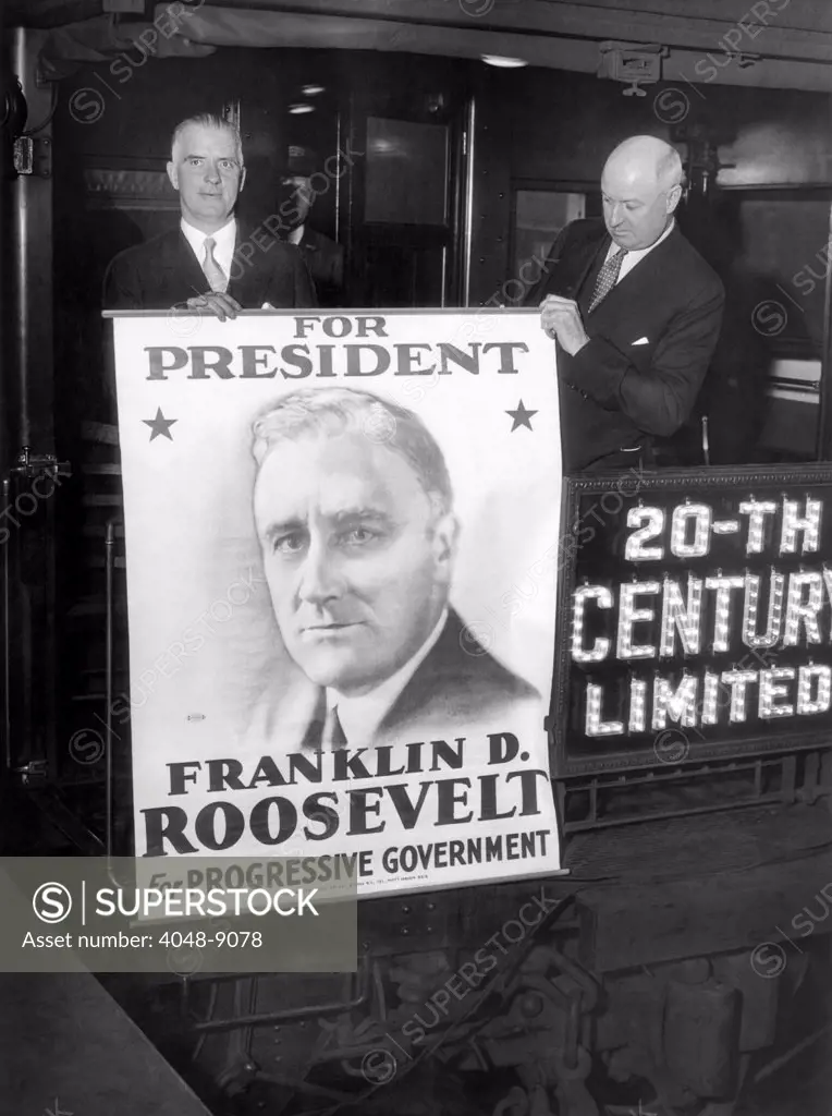 Giant poster of New York Governor Franklin Roosevelt, as a candidate for the Democratic presidential nomination. L-R: Edward J. Flynn, Secy of NYS, and James A. Farley (right) NYS Democratic Chairman, at Grand Central Station, NYC, as they left for Chicago. June 16, 1932.