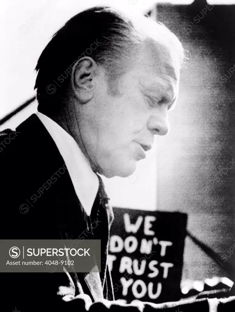 President Ford encounters an unfriendly sign, 'We Don't Trust You', which campaigning for President. Sept.9, 1976.