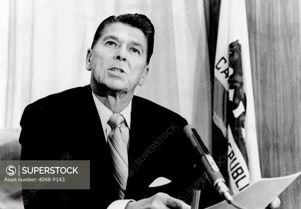 California Gov. Ronald Reagan reads a statement disclosing that he did pay income tax for the last year and has paid $91,128 in state income taxes since becoming Governor. Reagan confirmed that he paid no state tax for 1970 because of heavy 'investment losses.' May 6, 1971.