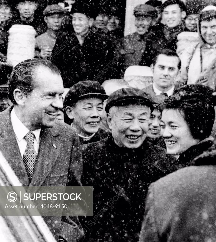 President Nixon, enjoys a laugh with his Chinese guides as he mingles with a crowd outside the Forbidden City in Beijing. Feb. 25, 1972.
