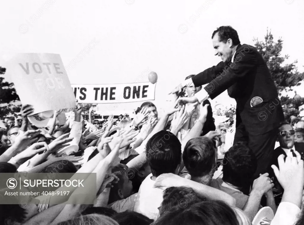 Richard Nixon, Republican Presidential nominee, reaches back to the sea of supporters' hands. Willingberg, New Jersey. Sept. 21, 1968.