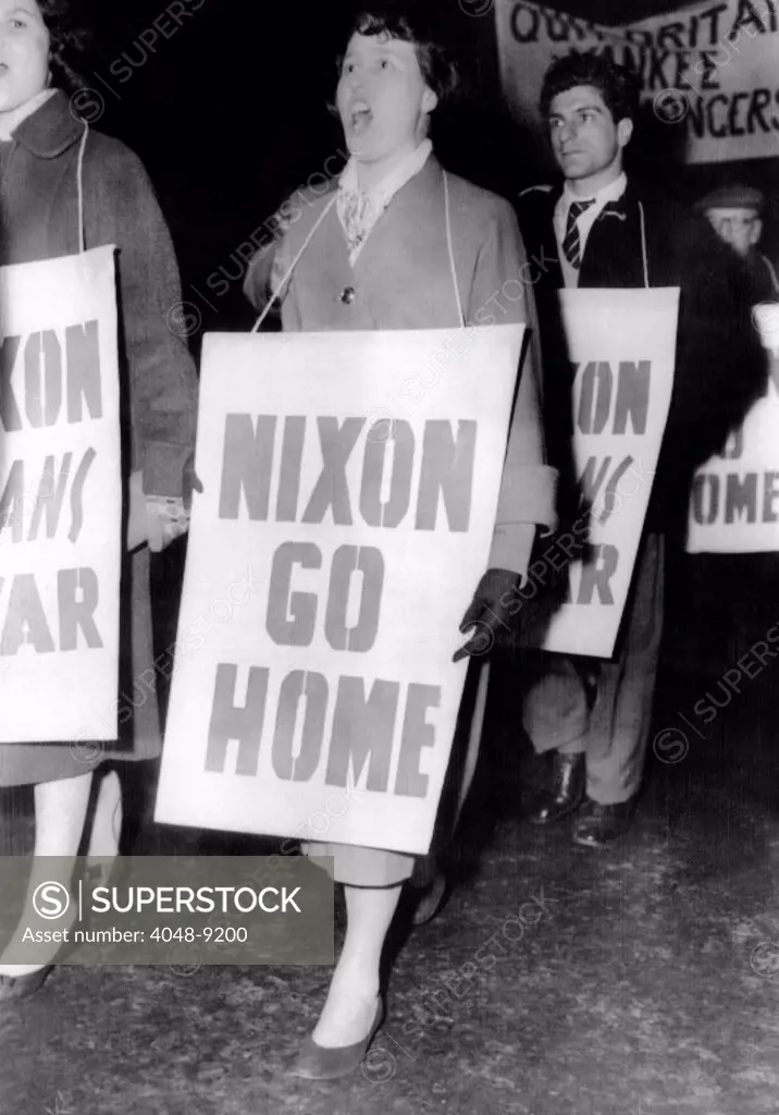 Nixon Go Home', are the signs carried by 400 demonstrators against US Vice President Richard Nixon on London's Piccadilly Circus. Nov. 25, 1958.