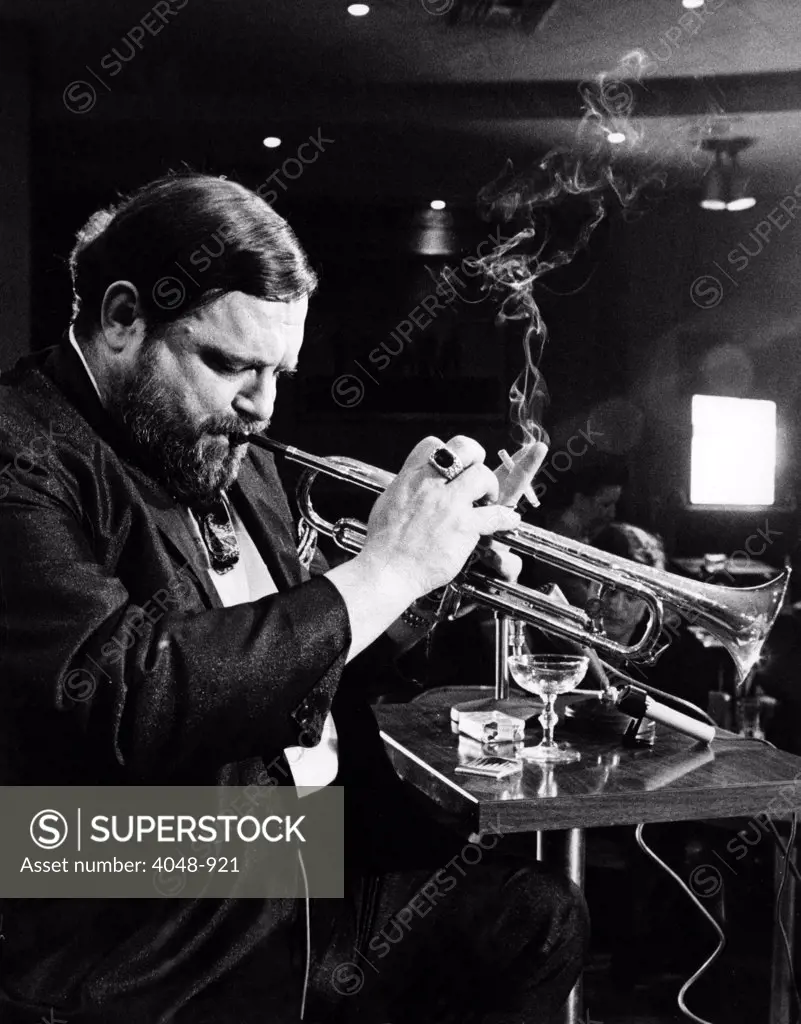 NEW ORLEANS, Al Hirt shown in his club March 5, is back to playing his trumpet a month after an accident to his upper lip. Still unable to play his full range of notes, he felt his lip is healed enough to play with his group. New Orleans, LA, March 11, 1970.