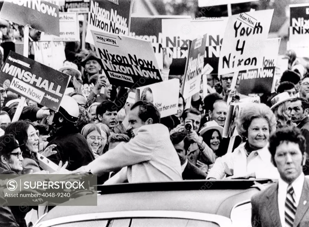 President Richard Nixon shakes hands with bystanders on his 80-mile motorcade campaign swing through Northeast Ohio. Oct. 28, 1972.