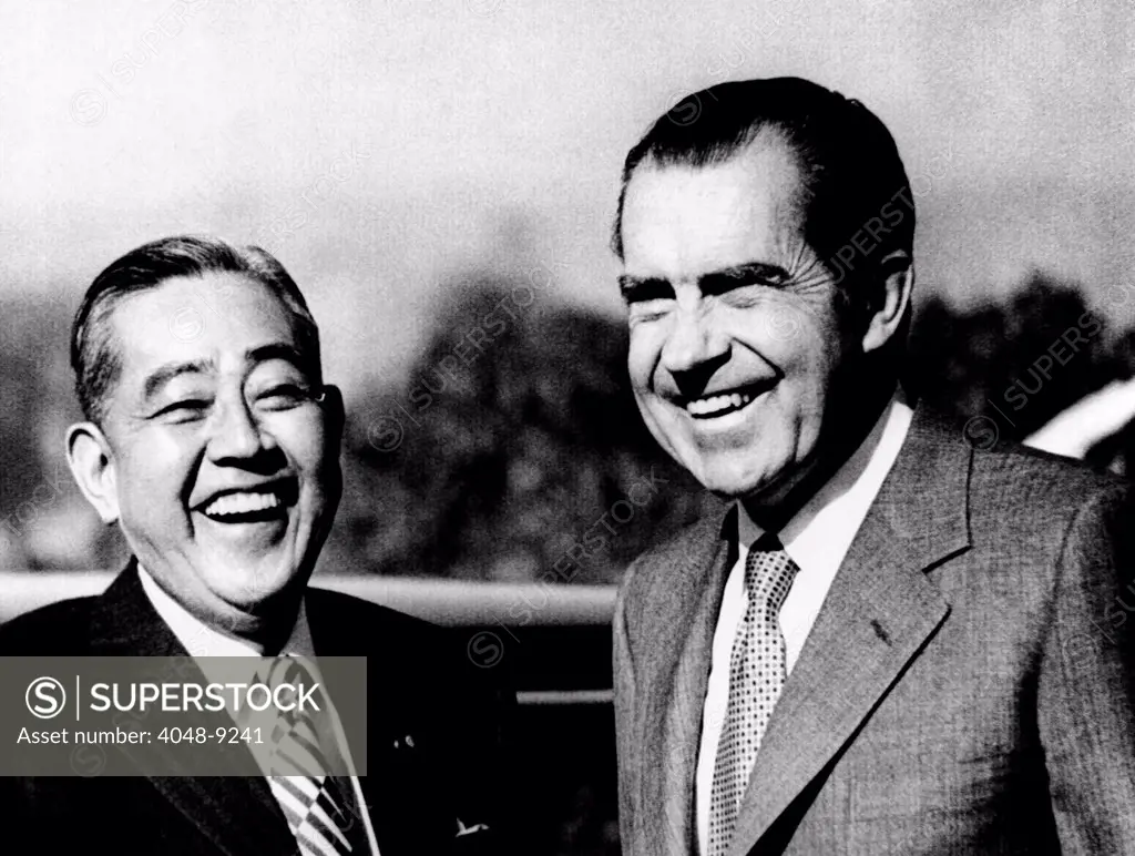 President Richard Nixon and Japanese Prime Minister Eisako Sate share a laugh on the first of two days of private talks. San Clemente, California. Jan. 6, 1972.