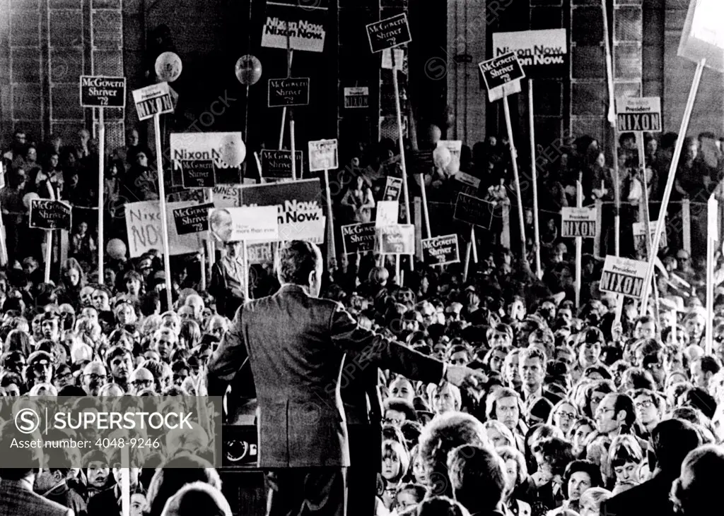 President Richard Nixon spoke to a rally of about 15,000 persons at the Tulsa international Airport. Nixon spoke inside a huge hanger where there was a sprinkling of McGovern-Shriver signs in the background. Nov. 3, 1972.