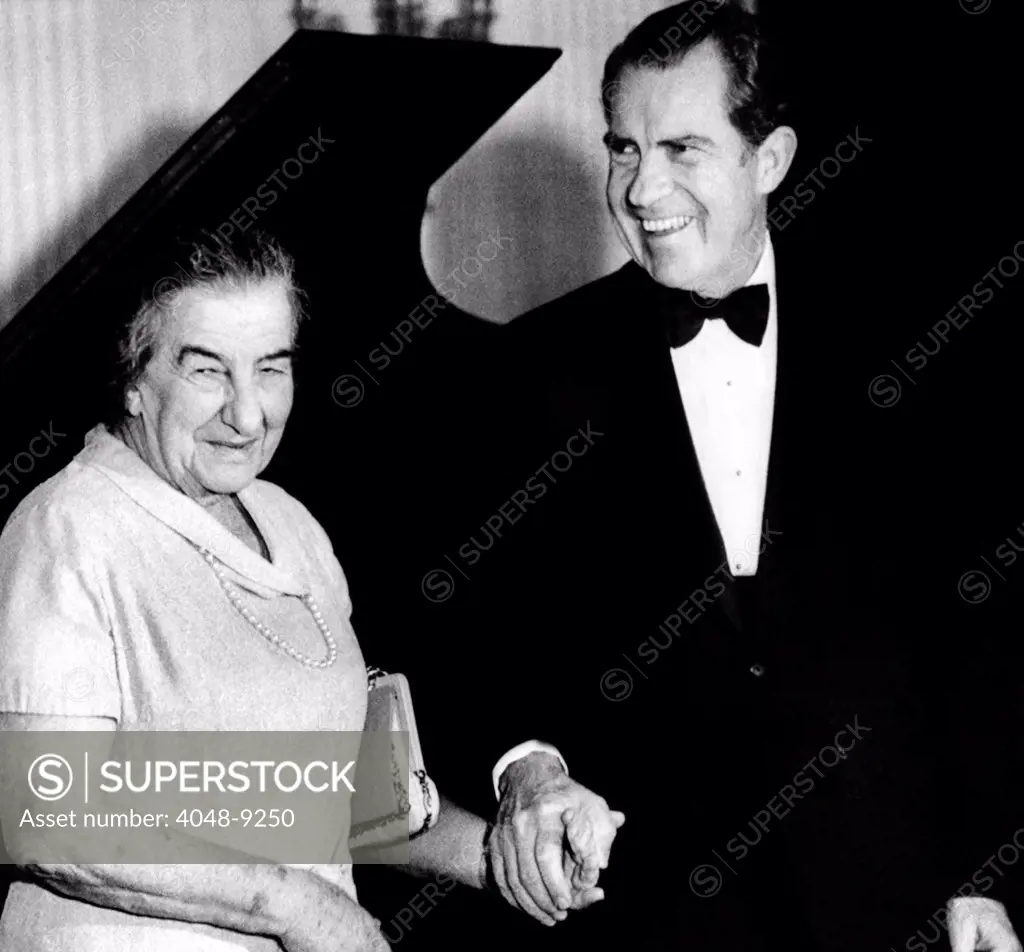 President Richard Nixon and Israeli Prime Minister Golda Meir hold hands following a White House dinner. March 1, 1973
