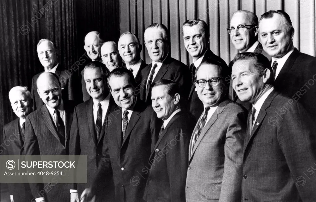 President-elect Richard Nixon presented his first Cabinet, via television on Dec. 11, 1968. L-R: Front. David Kennedy, Treasury, Melvin Laird, Defense, VP-elect Spiro Agnew, Nixon, John Volpe, Transportation, Robert Mayo, Budget, Robert Finch, HEW, Back Row: William Rogers, State, Winton Blount, Postmaster, John Mitchell, Atty General, Maurice Stans, Commerce, George Romney, HUD, Clifford Hardin, Agriculture, George Shultz, Labor, and Walter Hinckle, Interior.