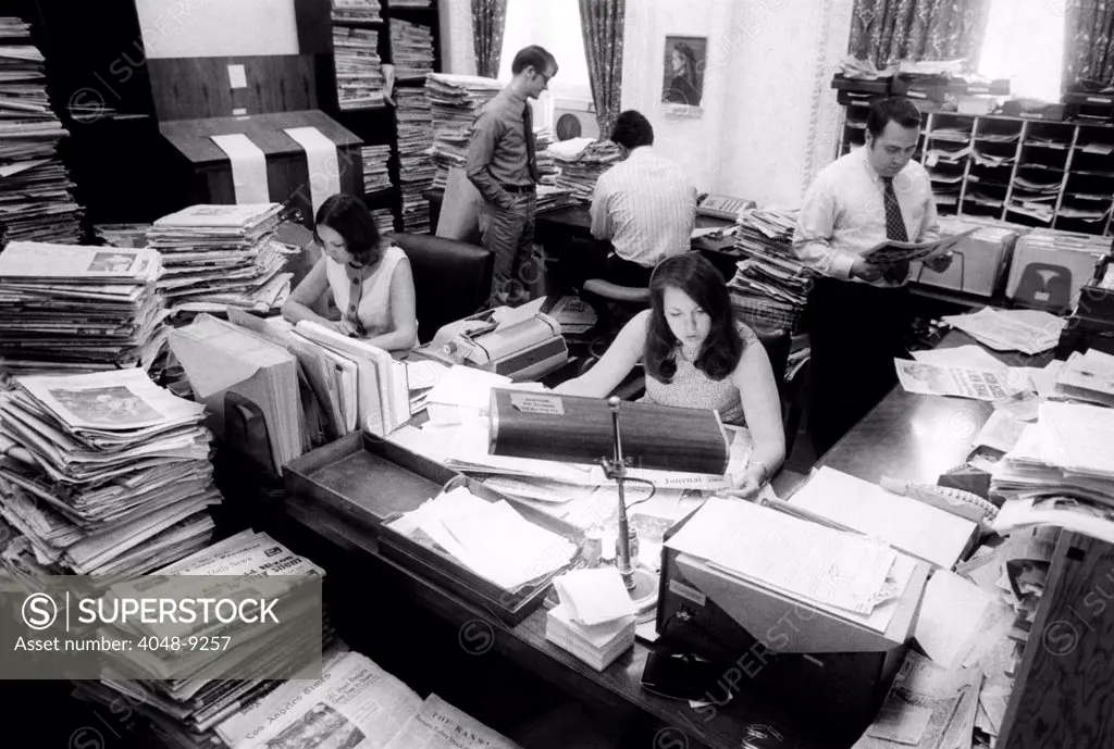 The Presidents daily news briefing,' is produced by five young White House staffers. They condense 45 daily newspapers and television news about the President, to 25 to 30 pages. Copies circulate to 100 White House staffers. June 1, 1973.
