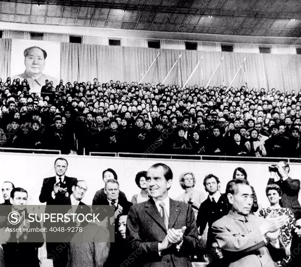 President Richard Nixon and Premier Chou En-lai applaud Chinese athletes prior to a gymnastic performance at the Capital Gymnasium. Beijing, Feb. 23, 1972.