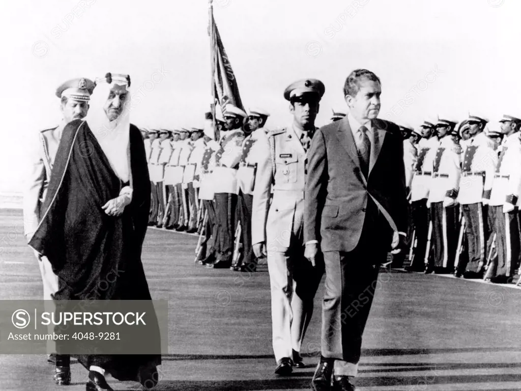 President Richard Nixon and King Faisel review an honor guard during arrival ceremonies in Jeddah, Saudi Arabia. June 15, 1974.