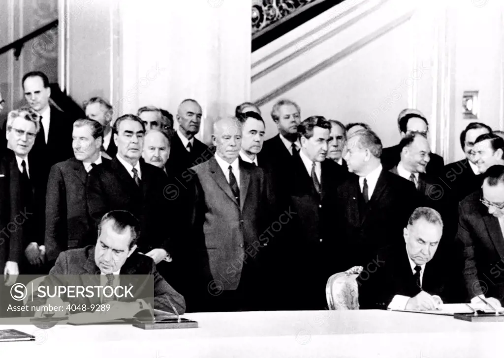 President Richard Nixon and Soviet Premier Alexei Kosygin sign an agreement for joint US-Soviet spaceflights. Standing behind the signers are L-R: Leonid Brezhnev, General Secy. Of the Communist Party, President Nikolai Podgorny, and Foreign Minister Andrei Gromyko. May 24, 1972