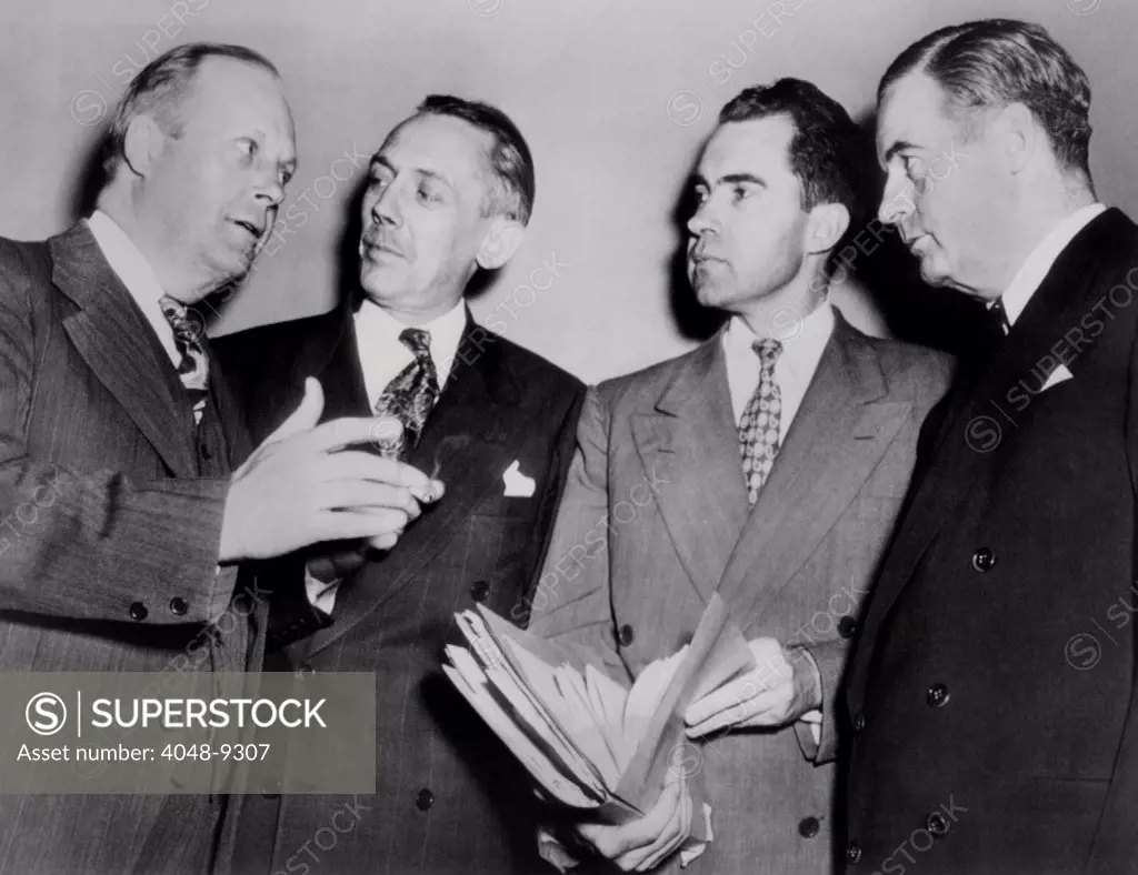 Congressmen after the House passage of the Mundt-Nixon communist control bill. The bill required Communist Party members to register with the Attorney General, but was not passed in the Senate. L-R: Karl Mundt, John McDowell, Richard Nixon, and Richard Vail. 1948.