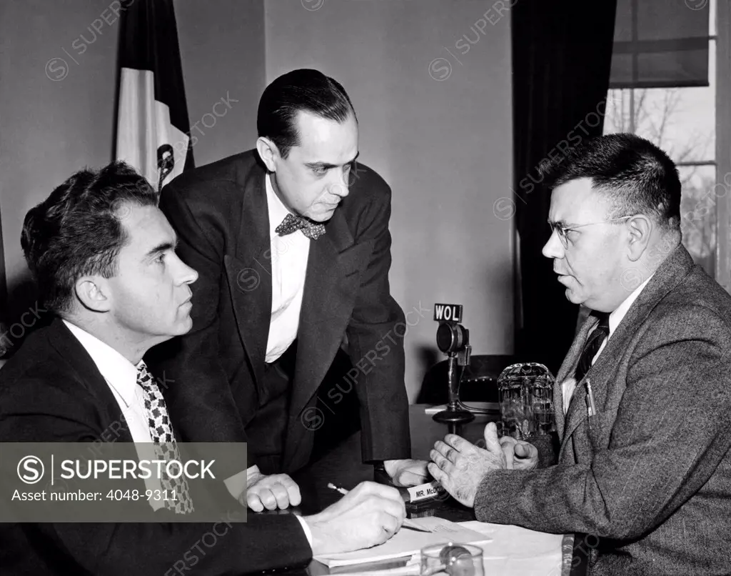 House Un-American Activities Committee at work. L-R: Richard Nixon, Robert Stripling, Chief Investigator, and Dr. Edward Condon, American nuclear physicist. Condon's scientific internationalism was interpreted as disloyalty in a March 2, 1948 HUAC report, claiming he was one of the weakest links in US atomic security. Before March 2, 1948.