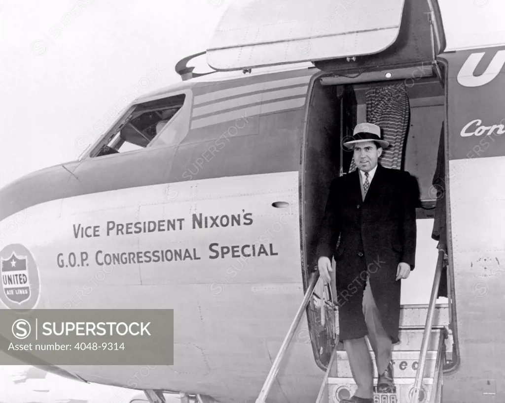 Vice President Richard Nixon exits his plane during the 1956 election campaign. The chartered a United Air Line Corvair was named 'Vice President Nixon's GOP Congressional Special'.