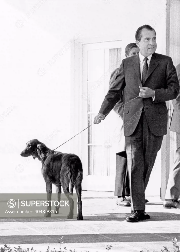 Richard Nixon with his six month old Irish Setter, King Timahoe. The dog was a gift from his staff, and was named for his mother's family home, the Irish town of Timahoe. Feb. 3, 1969.