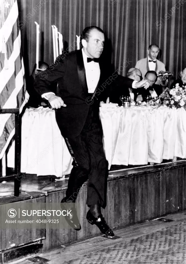 President Richard Nixon leaps from the dais at a memorial dinner 10/14/1969 in honor of the late President Dwight D. Eisenhower. The dinner was held on what would have been Eisenhower's 79th birthday.