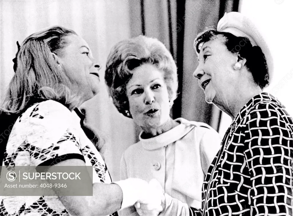 Pat Nixon, introduces Martha Mitchell (left), the flamboyant wife of the Attorney General, to Mamie Eisenhower at a White House reception for Senate wives. May 22, 1970.