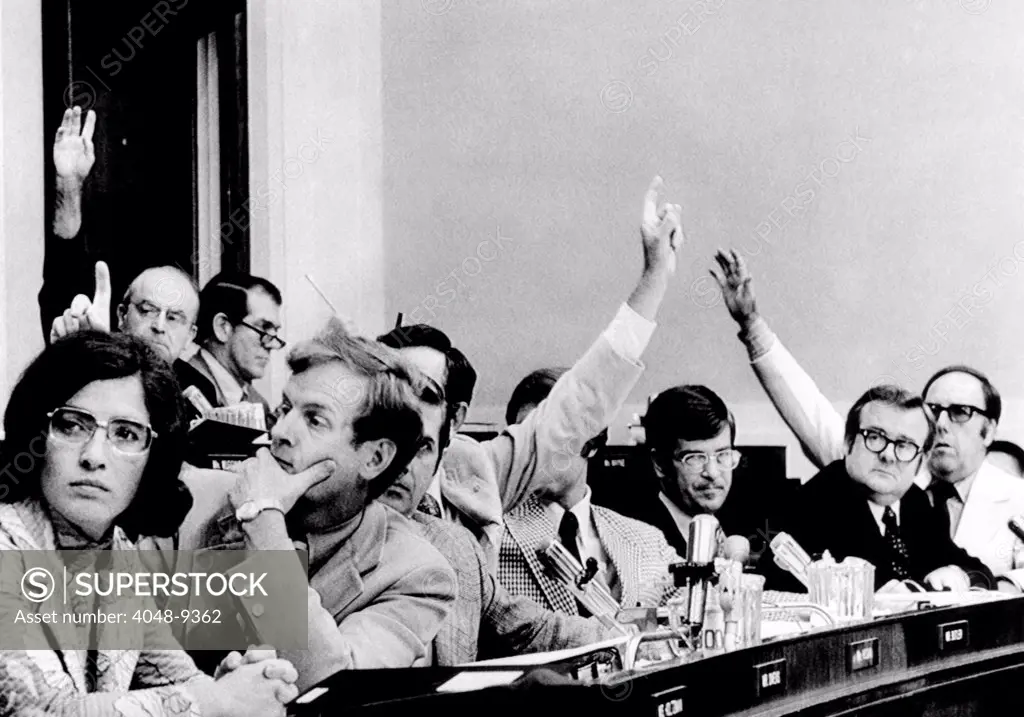 The House Judiciary Committee. The raised hands want to participate in the debate on a third article of impeachment of President Richard Nixon. Back row, L-R: David Dennis, R-Ind., Hamilton Fish, R-N.Y., Front row, L-R: Elizabeth Holtzman, D-N.Y., Wayne Owens, D-Utah, Lawrence Hogan, R-Md., Caldwell Butler, R-Va., William Cohen, R-Me., Trent Lott, R-Miss., Harold Froehlich, R-Wisc., and Carlos Moorhead, R-Calif. July 29, 1974.