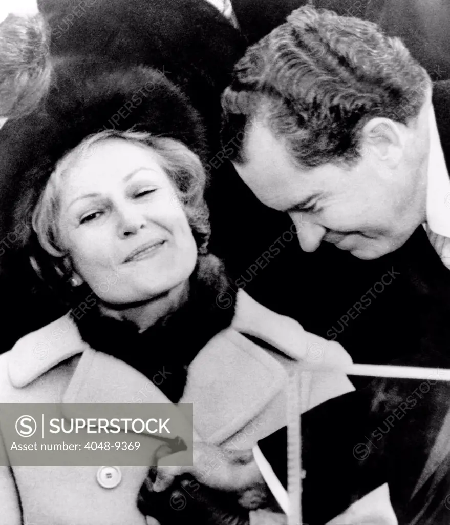 Pat Nixon grasps her husband's hand after he delivered his Inaugural Address. Jan 20, 1969.