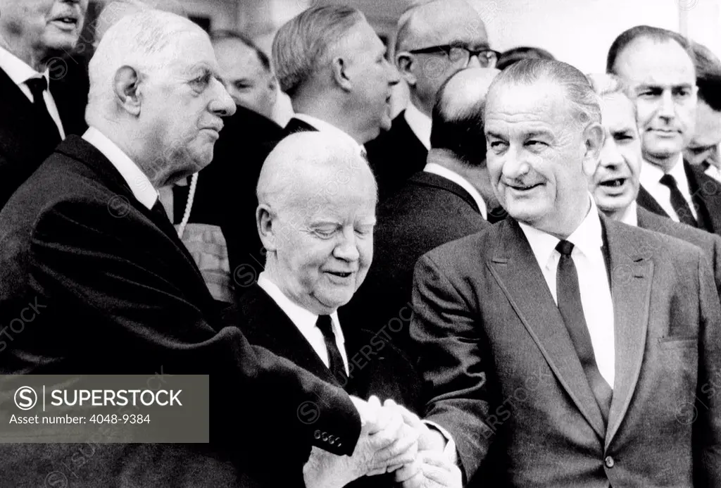 Heads of State at the funeral of Conrad Adenauer. L-R: Presidents Charles DeGaulle, Heinrich Luebke, and Lyndon Johnson in a three way handshake, April 25, 1967.