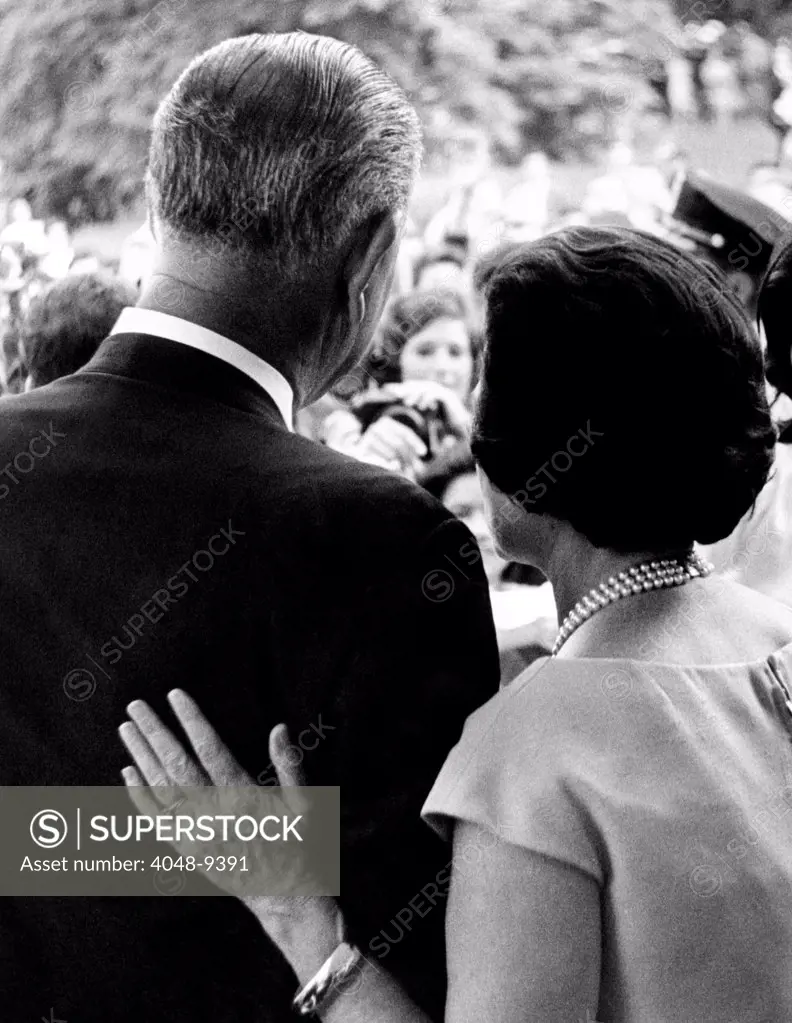 President Lyndon Johnson and wife Lady Bird during a White House ceremony. 1964.