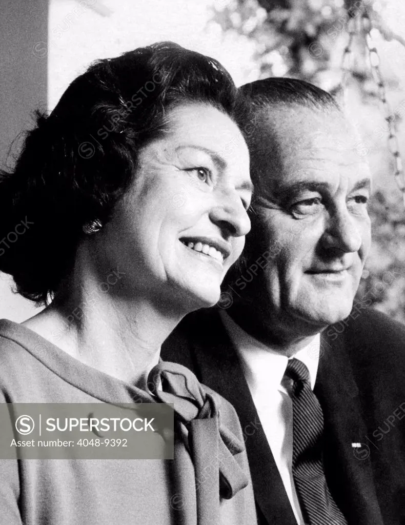 President Lyndon and Lady Bird Johnson after casting their ballots in the 1964 Presidential election. They are on the porch of Johnson's restored boyhood home. Nov. 3, 1964.