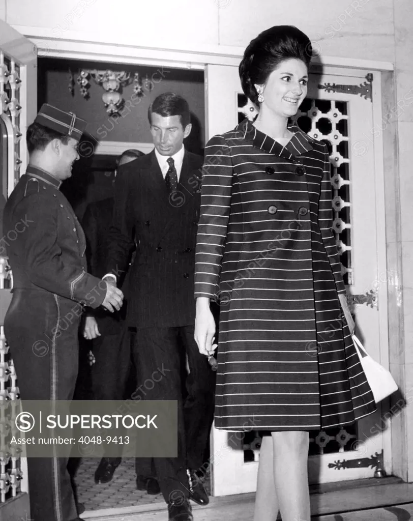 Lynda Bird Johnson precedes her escort, actor George Hamilton, as they leave a New York nightspot. June 23, 1967.