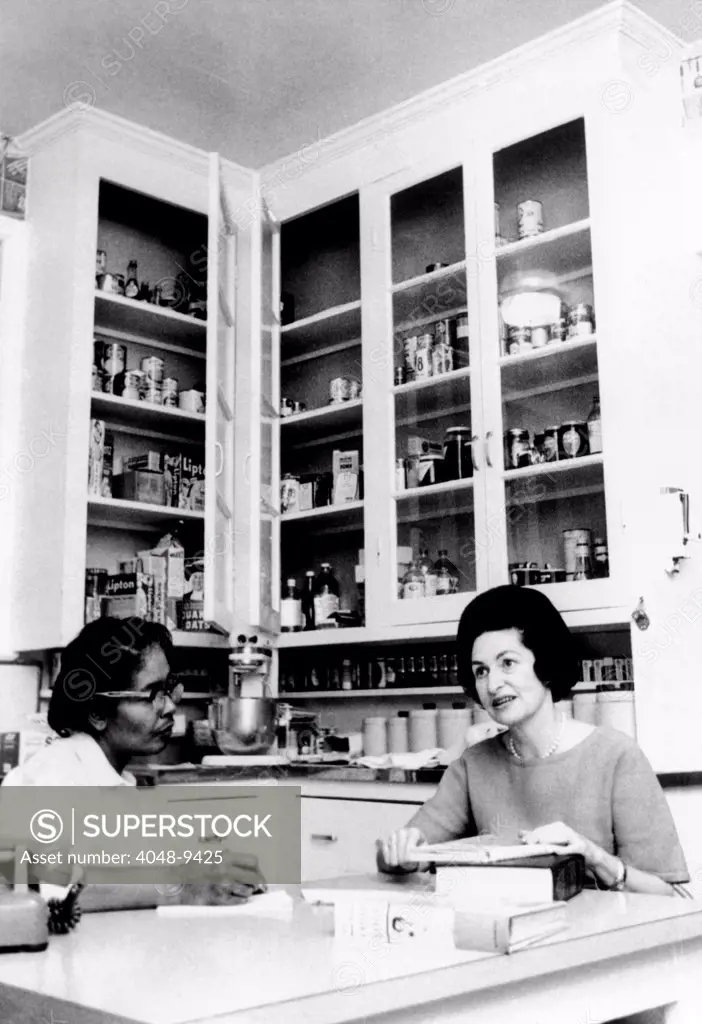 Lady Bird Johnson, in the kitchen with her African American cook, Zephyr Wright. Then the wife of the Vice President Lyndon Johnson, she was planning for a formal dinner. March 3, 1963.